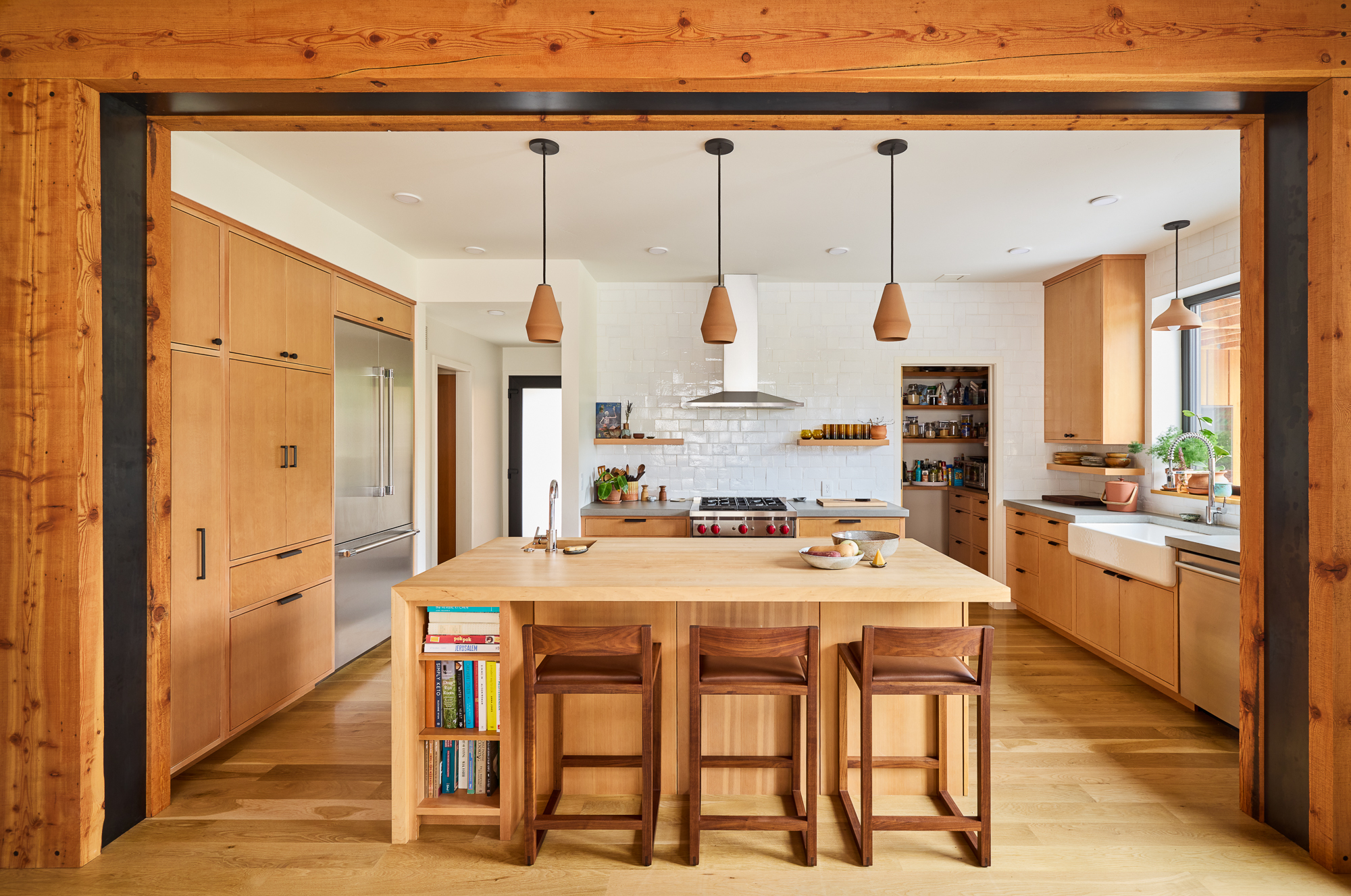 Linden Residence — Kitchen island & timber-framed opening